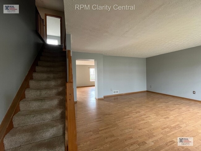 Photo - Spacious 4-Bedroom Home with Fenced Backyard, Deck, and 2-Car Garage