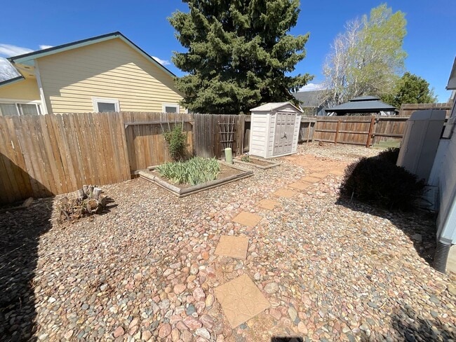Photo - 4 Bedroom Home Available Near Research Pkwy & Scarborough Dr!