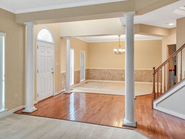 Photo - Single Family Home with 2 Car Garage Deck ...