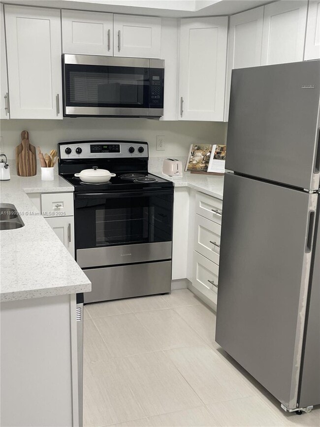 Building Photo - 5580 NW 61st St Unit 616