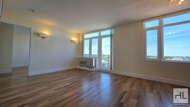 Photo - Top-Floor 1-Bedroom with Private Balcony & Manhattan Skyline Views! Unit 7B