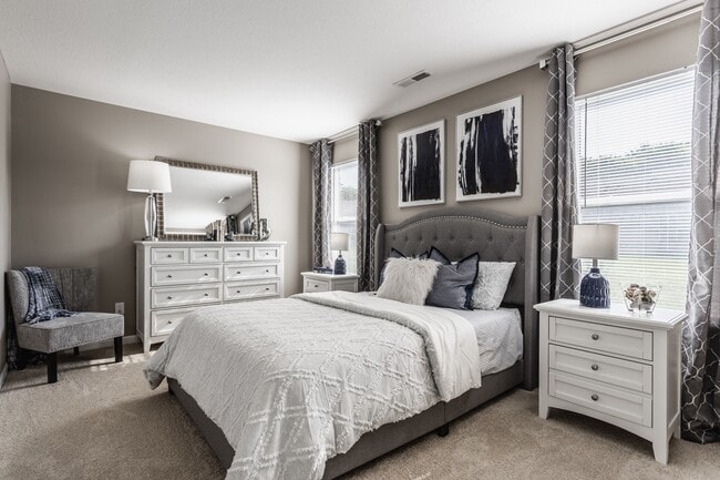 Relax in a serene bedroom filled with natural light, featuring a spacious layout and thoughtful design for comfort and style.