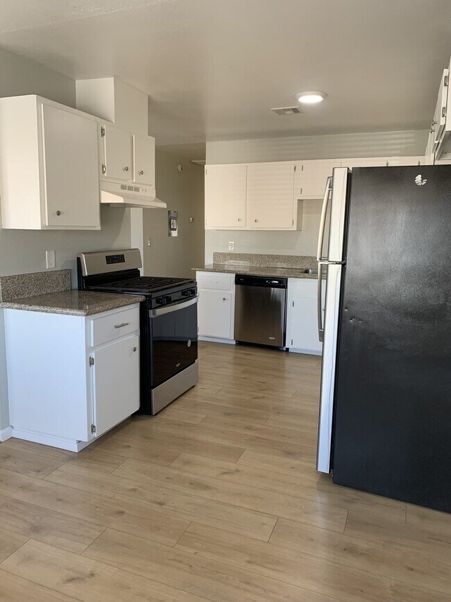 Photo - Updated Unit with Vinyl Floors & Stainless...
