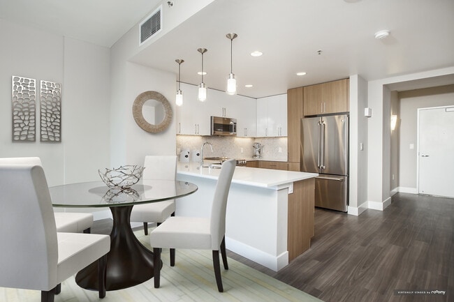 Signature Collection Dining and Kitchen Area with Hard Surface Vinyl Plank Flooring
