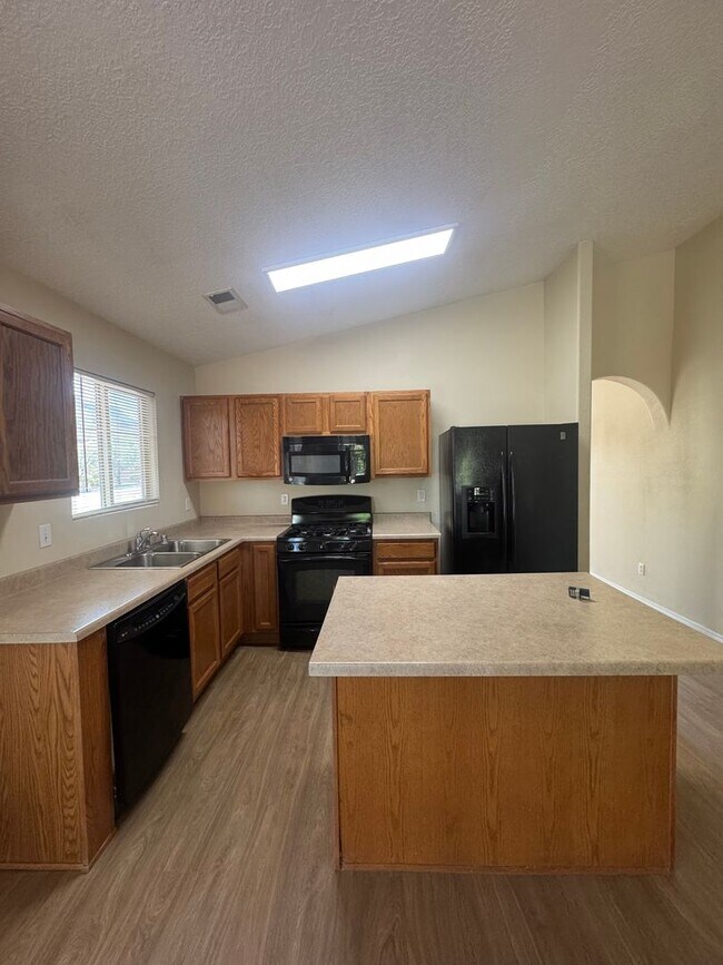 Photo - 4 bed 2 bath home! Fresh New Paint & Flooring Throughout