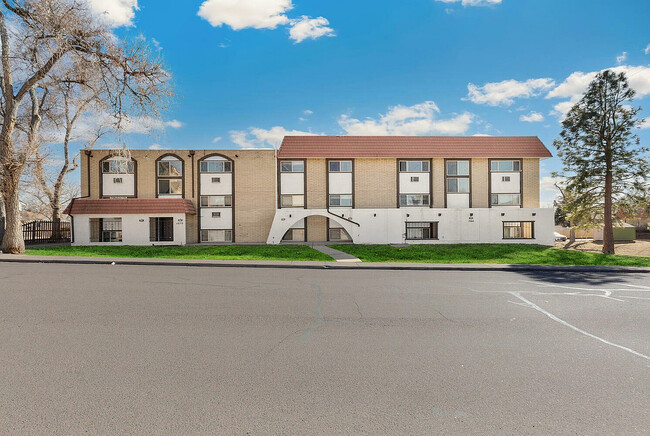 Charming apartment building with modern architecture, featuring large windows and scenic views.