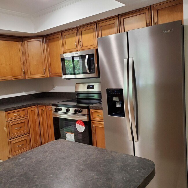 Photo - Location, convenience, comfort. This 4 bedroom plus den, 2 bath has it all!