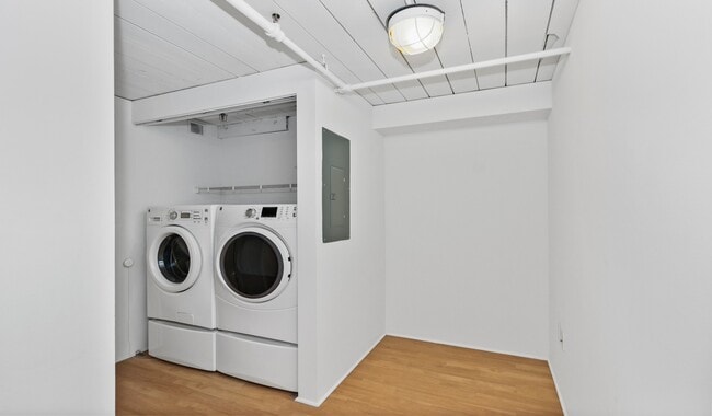 Renovated in-unit laundry with front facing machines