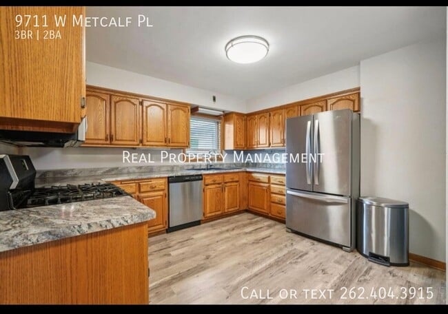 9711 W Metcalf Pl