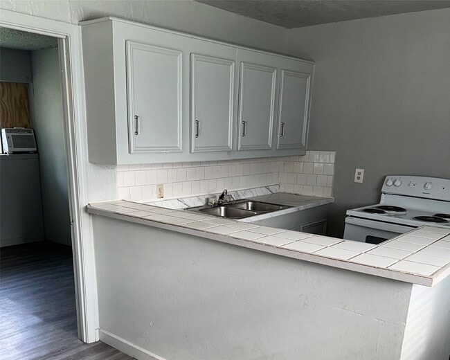 Building Photo - 5409 Suez St Unit 3