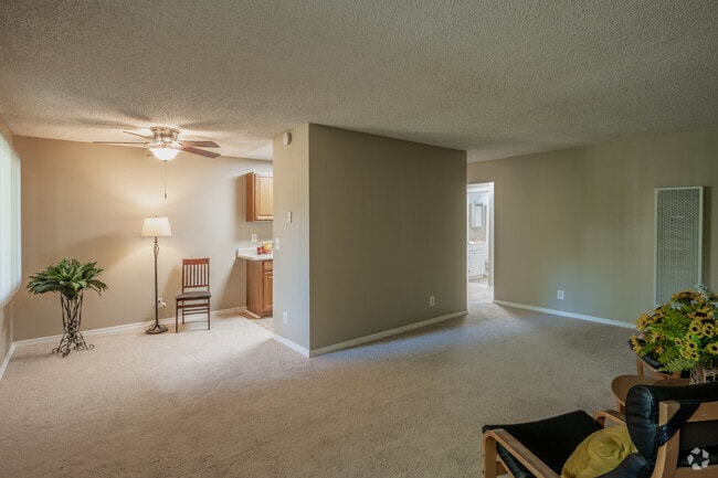 1BR, 1BA - 740SF - Living Room and Dining Room
