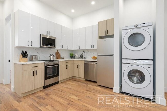 Photo - Brand New 4 Bed, 2 Bath with In-Unit Laundry, Private Balcony & Central Air