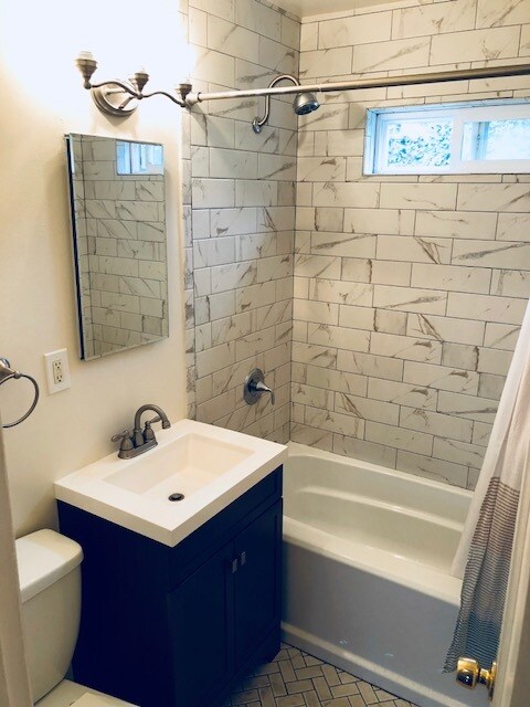Remodeled bath with all tile tub surround and floor, vanity, etc - 7222 East Burnside Unit Apt #3