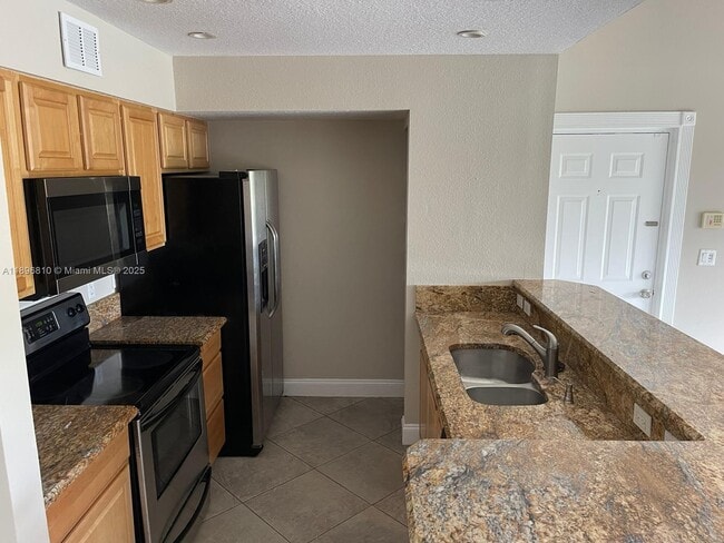 Building Photo - 1727 Village Blvd Unit 308