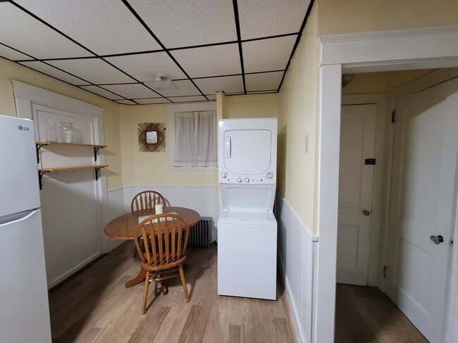 Table, Washer and Dryer, Pantry, and Closet - 131 Northern Ave Unit Fully Furnished Apartment