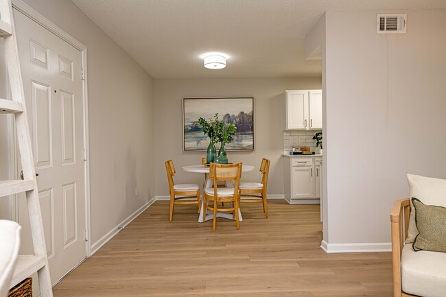 Dining room with hardwood-style flooring