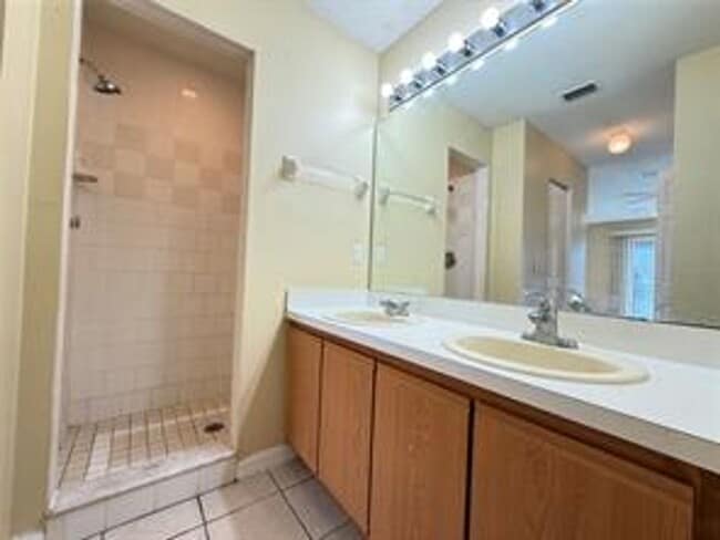 Photo - Charming 3-bed, 2-bath POOL home with 2-car garage. Features ceramic tile flooring, updated kitch...