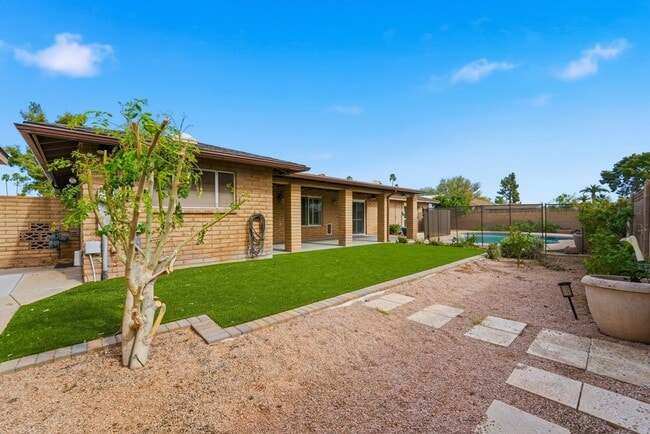 Photo - Welcome to this beautiful 4-bedroom, 3-bathroom home in Tempe Arizona!
