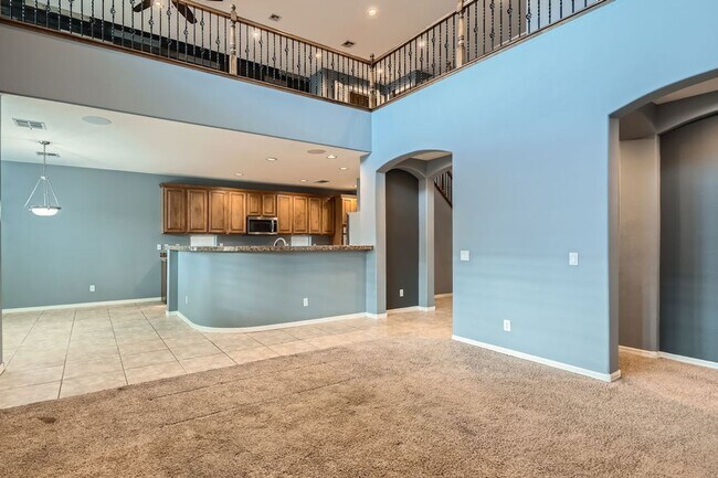 Photo - Gorgeous 5 bd, 3 1/2 bath, 3 car in gated community with strip and mountain views!
