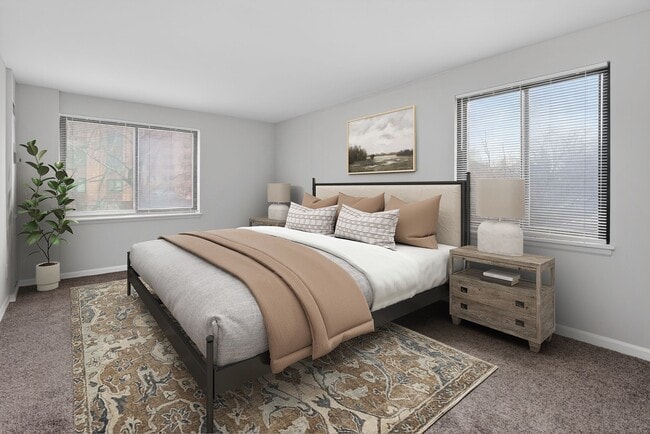 Welcome to The Venue Apartment Homes, where modern elegance meets comfort. This beautifully designed bedroom offers serene views and stylish furnishings to enhance your lifestyle. Embrace tranquility today—schedule your tour now! - The Venue Apartment Homes
