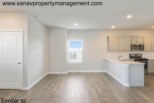 Photo - "Stylish 4-Bedroom Home in Prairie Trail with Modern Amenities"