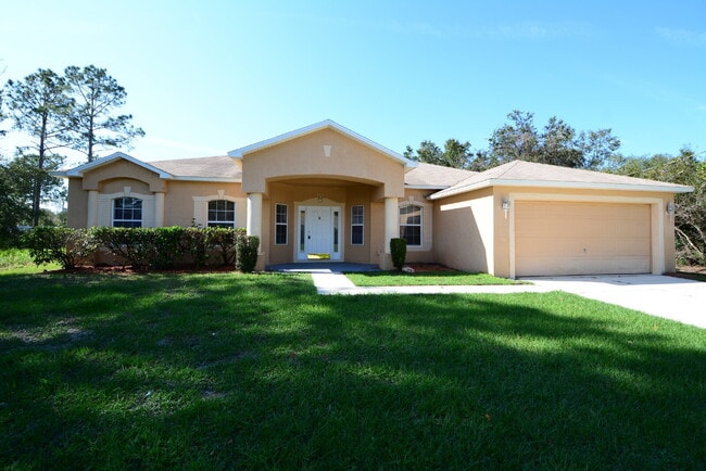 Building Photo - "Spacious 4-Bed Oasis in Palm Coast with 2... Rental