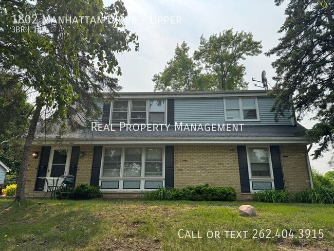 Building Photo - 1802 Manhattan Dr Unit Upper Rental
