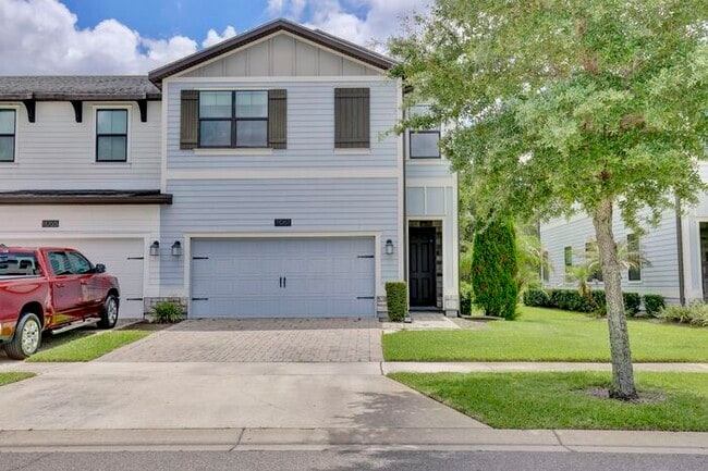 Building Photo - Beautiful 4/3.5 Townhome with a Spacious 2 Car Garage Located in Trails at Moss Park - Orlando