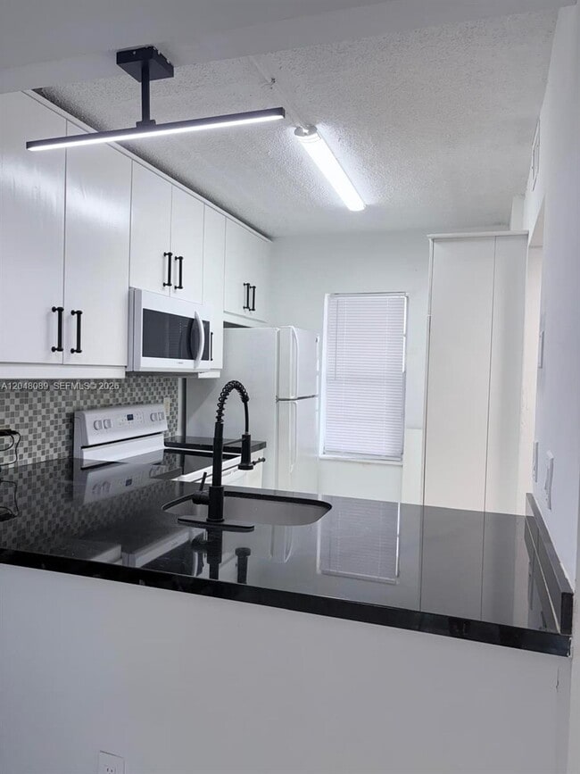 Building Photo - 8305 Royal Palm Blvd Unit 103