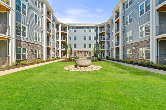 Enjoy beautiful courtyard views from your 1, 2 or 3 bedroom apartment at Hawthorne at Mills Gap - Hawthorne at Mills Gap Apartments