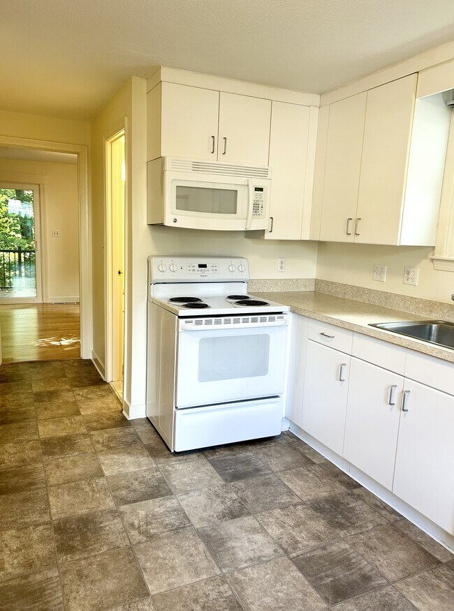 New kitchen currently being installed - stainless steel appliances and granite counter tops