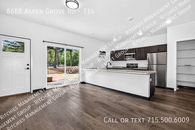 Building Photo - 8688 Aspen Ln Unit 714