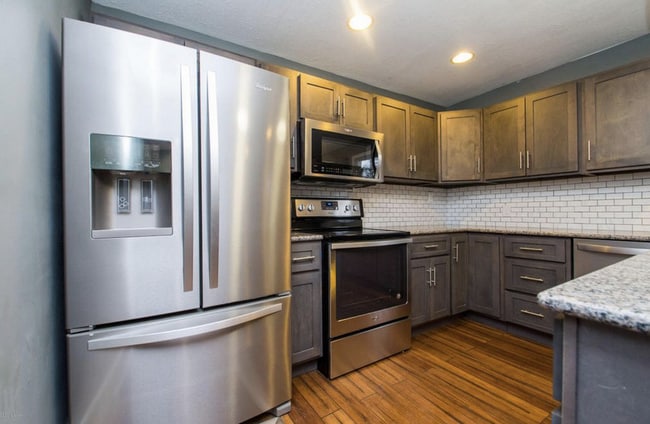 Brand new kitchen with stainless appliances.