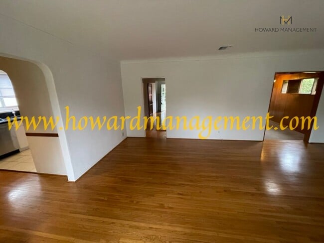 Photo - Beautiful home with large Den, hardwood floors, grassy backyard and dettached 2 car garage.