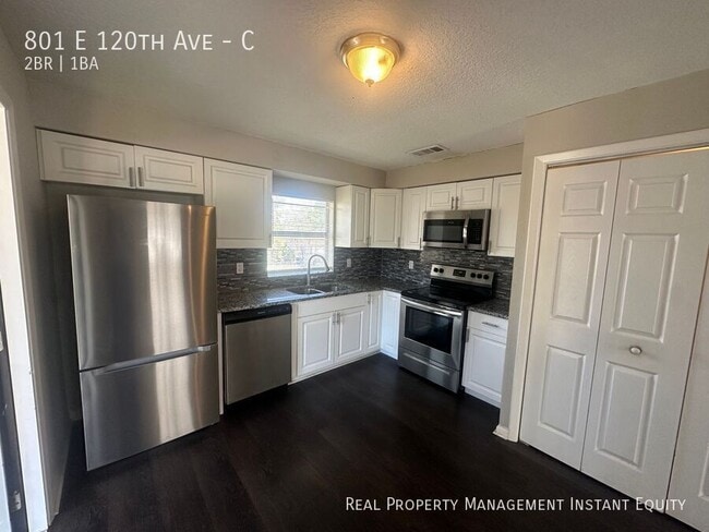 Building Photo - 801 E 120th Ave Unit C