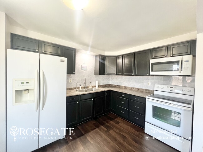 Photo - Spacious 3-Bedroom Home with 3 Parking Spaces & Backyard in Cambridge