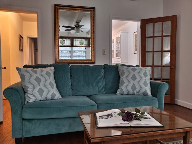 "Rose Garden" LR view into kitchen - West Ender Apartments