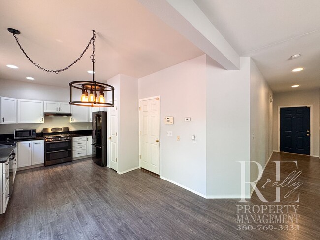 Photo - Dual Primary Suites, Huge Backyard Deck & Sun-Filled Living Spaces Near Everyday Conveniences