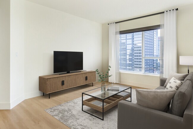Renovated Package I living room with hard surface flooring