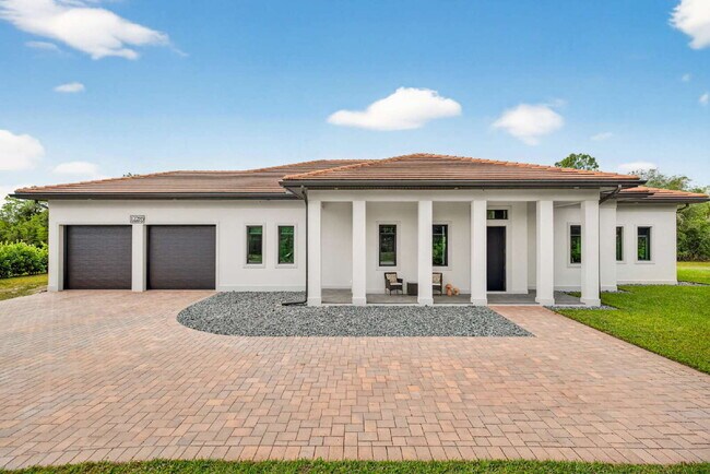 Newly built upscale home on a private 1-acre lot in the quiet Bell Villa community of Bonita Spri...