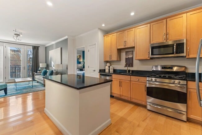 Gourmet kitchens with wood cabinets, granite countertops, and stainless steel appliances