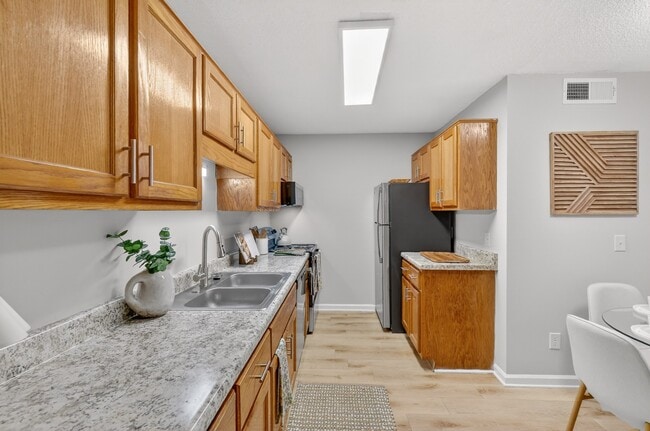 Spacious kitchen with generous counter space and dining area in Murfreesboro apartment