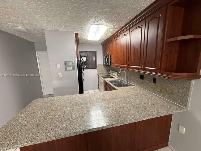 Building Photo - 6055 W 19th Ave Unit 215 Rental