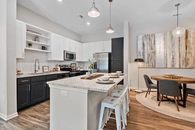 Kitchen with Spacious Breakfast Bar at the Newton Apartments in Charlotte, NC - The Newton Apartments