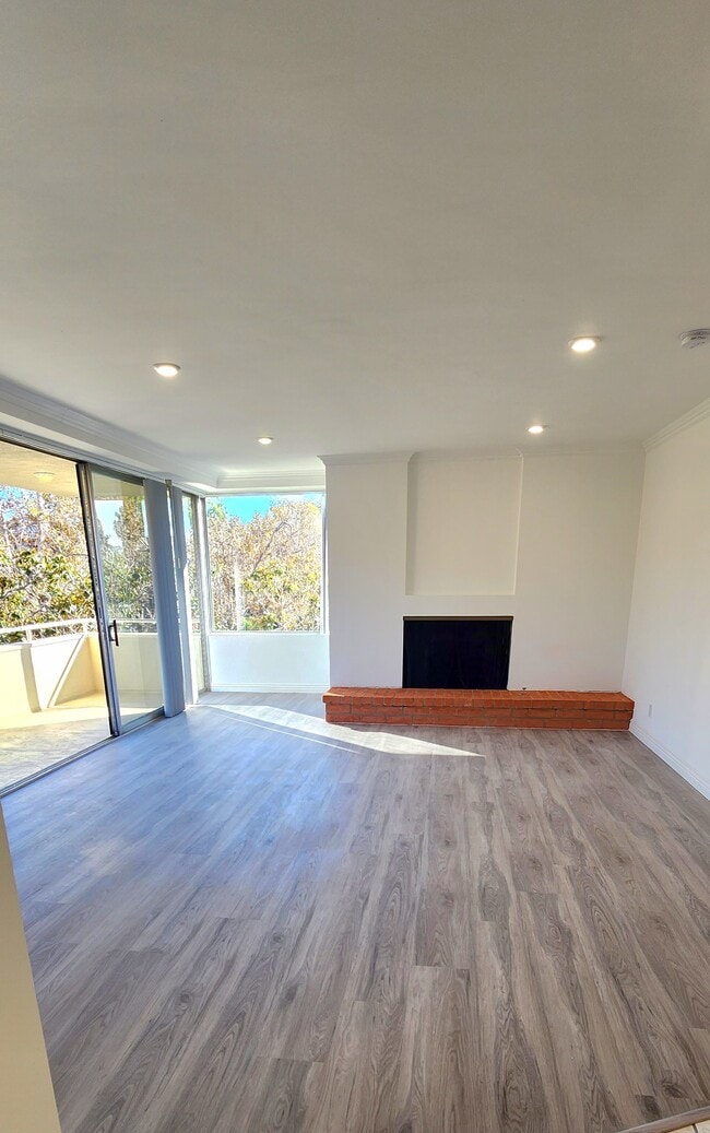 Living Room with Fireplace - 303 N Swall Dr Unit 301