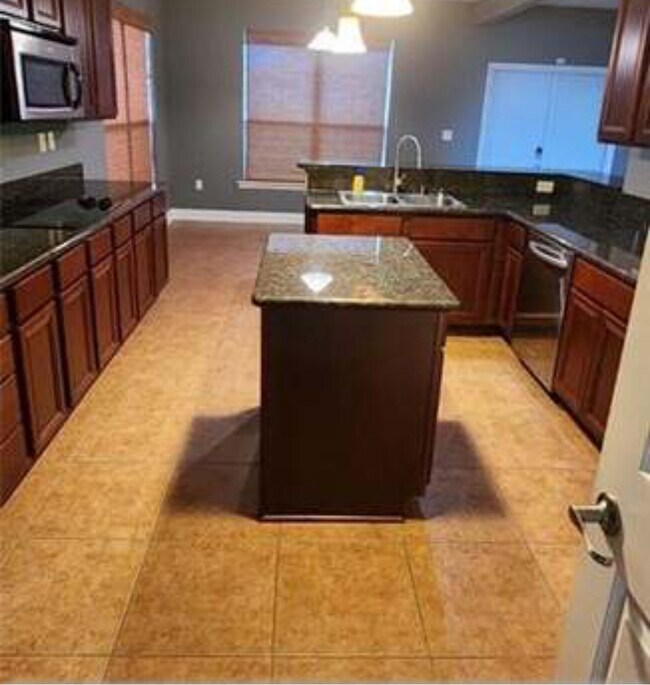 Beautiful kitchen with all new cabinets and granite countertops. Refrigerator and stove included. - 39152 Cajun Bayou Ave
