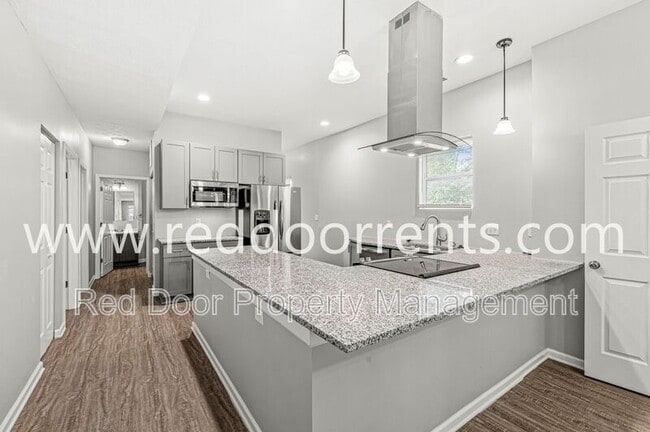 Building Photo - 2345 N Kenwood Ave Unit A