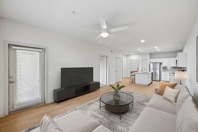 Renovated Package I living room with hard surface flooring