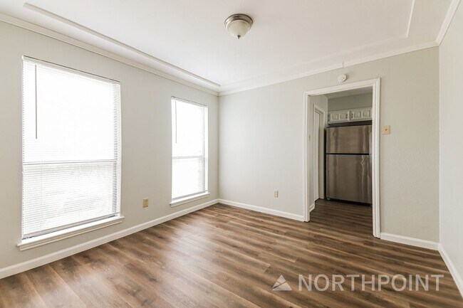Photo - 3 BR/2BA | Newly Renovated Single Family Home | Fireplace in living room | Fenced backyard!