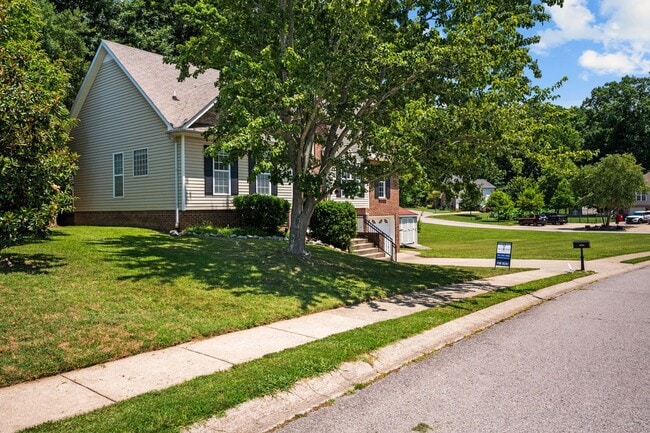 Photo - Stunning Stone Fireplace • Finished Basement • Fenced Yard
